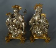 La Virgen con el Nio Jess y San Jos con el Nio, para de figuras realizadas en plata, apoyan sobre bases de bronce ci