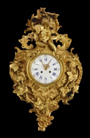 Reloj cartel bronce dorado con angelitos.