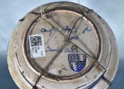 Antiguo plato hondo de cerámica española con esmalte azul y águila bicéfala. Cascaduras. Diámetro: 25,5 cm.