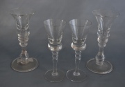 Doce copas altas de licor, de vidrio con molduras. Diez de un diseño y dos similares con escudo G III coronado.