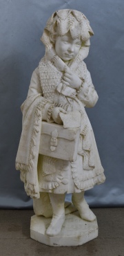 Niña con valija, escultura de mármol tallada, firmada  Andreini, mínimos deterioros. Alto: 103 cm.-