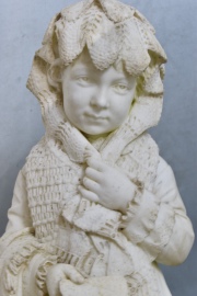 Niña con valija, escultura de mármol tallada, firmada  Andreini, mínimos deterioros. Alto: 103 cm.-