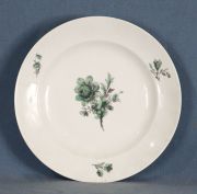 Plato de porcelana con flores verdes