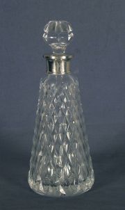 Botellon vidrio con gollete plata.