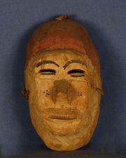 Mascara Chane, Cabeza masculina, de palo borracho, h: 25 cm. Hacia 1930/40