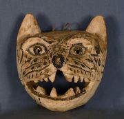 Mascara Chane, Felino, de palo borracho, h: 24 cm. Hacia 1950.