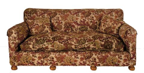 Sofa confortable, tapizado con flores.