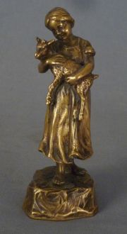 Obergé 'Niña con cabrito', escultura de bronce.
