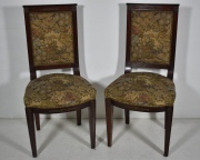 Cuatro sillas Estilo Imperio, con aplicaciones de bronce, tapizado floral.