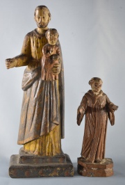 SAN JOSE Y EL NIÑO y SANTO, dos figuras de madera tallada y policromada. Alto: 27, 5 y 16, 3 cm.
