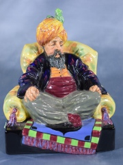 Abdullah, Personaje en sillon con turbante, figura Royal Doulton. Alto: 15,5 cm.