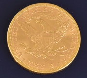 Moneda Norteamericana de oro de 10 dólares. Año 1894. Diámetro: 1,7 cm. Peso: 16,74 gr.