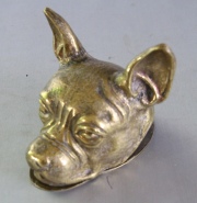 Dos Piezas en bronce: cabeza de perro y peq. taza.