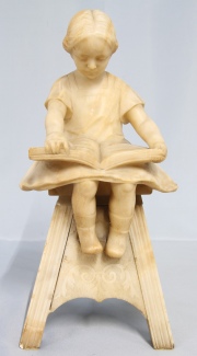 Montoni, E. Niña Leyendo. escultura marmolina. Restauros. Alto: 43 cm.